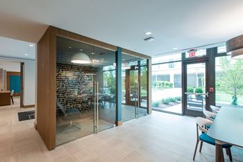 A glass door with a wooden frame leads to a patio.